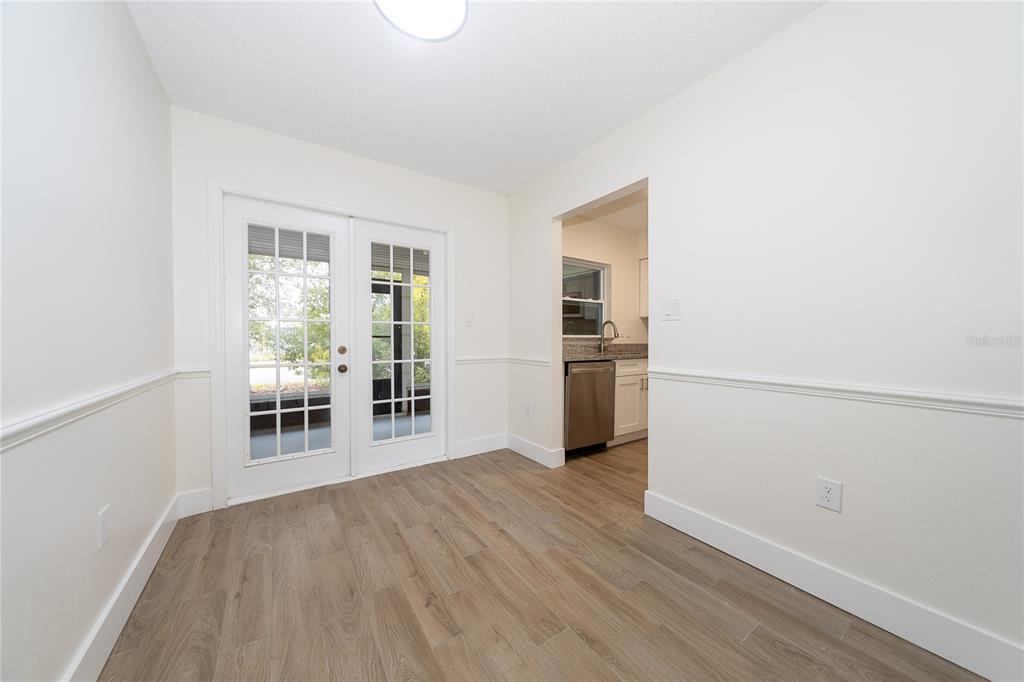 8557 Pilgrim Court New Port Richey, FL 34653 - Photo 9 of 29 a view of a livingroom with wooden floor