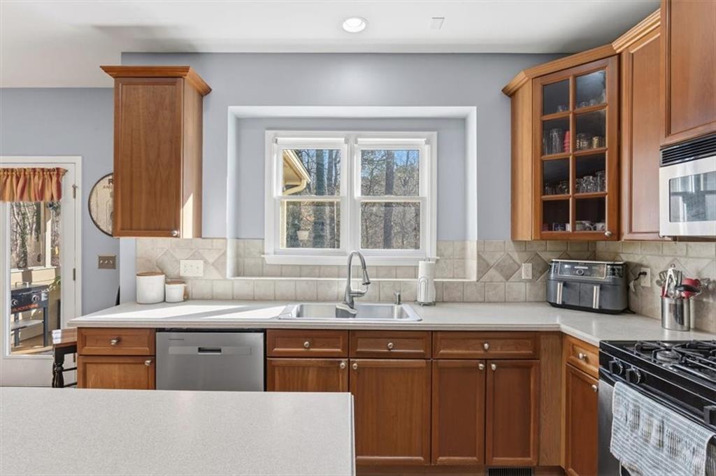 175 Gellmore Lane Acworth, GA 30101 - Photo 18 of 67 a kitchen with stainless steel appliances granite countertop a sink stove and cabinets