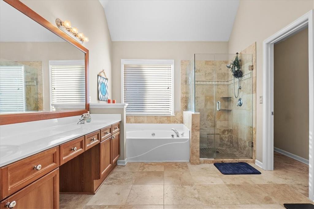175 Gellmore Lane Acworth, GA 30101 - Photo 2 of 67 a spacious bathroom with a granite countertop sink a large mirror and a bathtub