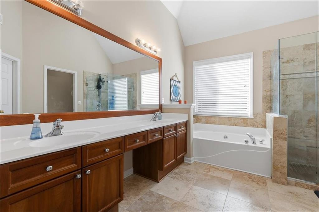 175 Gellmore Lane Acworth, GA 30101 - Photo 28 of 67 a spacious bathroom with a granite countertop tub sink and mirror