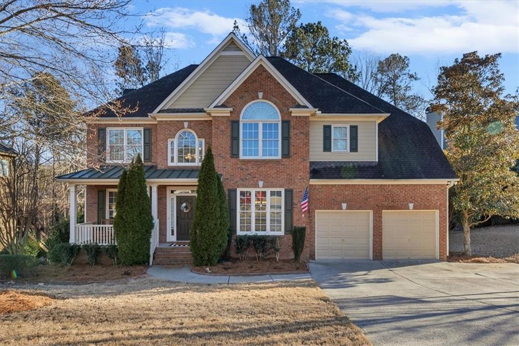 175 Gellmore Lane Acworth, GA 30101 - Photo 3 of 67 a front view of a house with a yard and garage