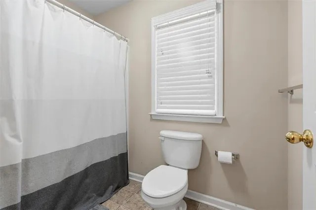 a living room with furniture wooden floor and a table