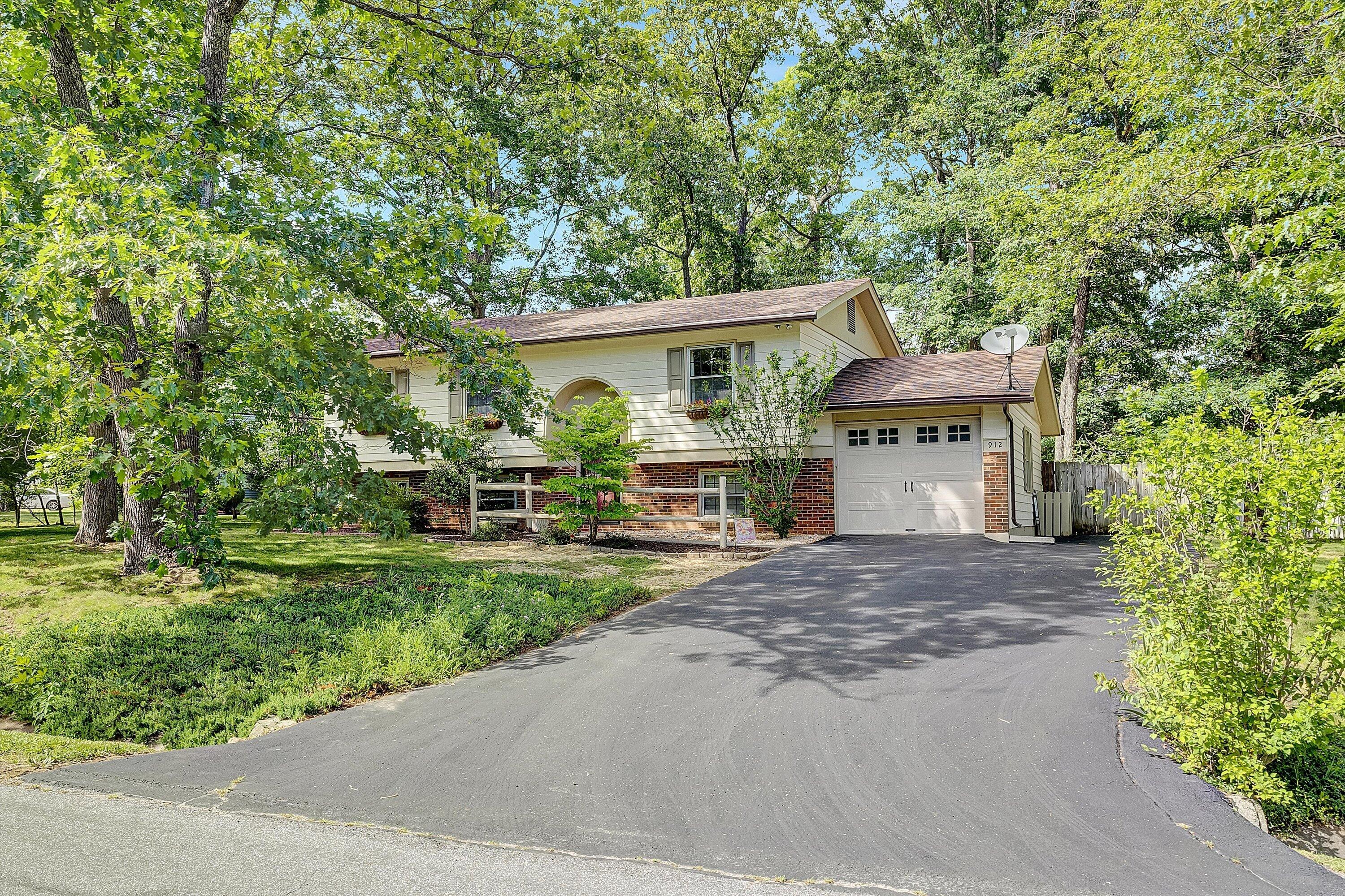 912 Cherokee Trail Covington, VA 24426 - Photo 31 of 31 a front view of a house with a yard and an trees
