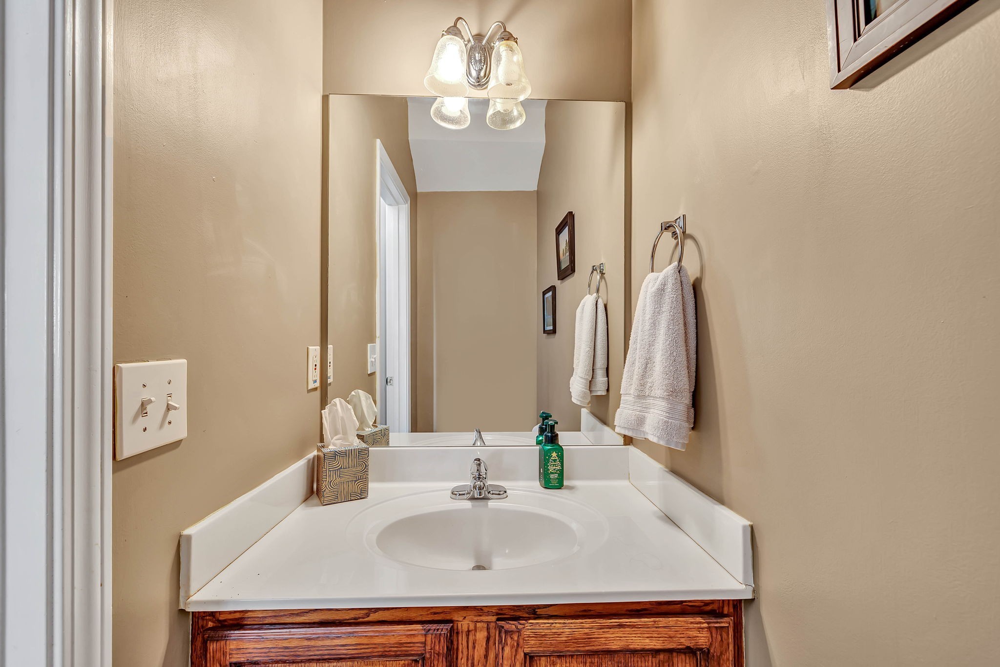 1101 Downs Boulevard, Unit I104 Franklin, TN 37064 - Photo 11 of 22 a bathroom with a sink and a mirror