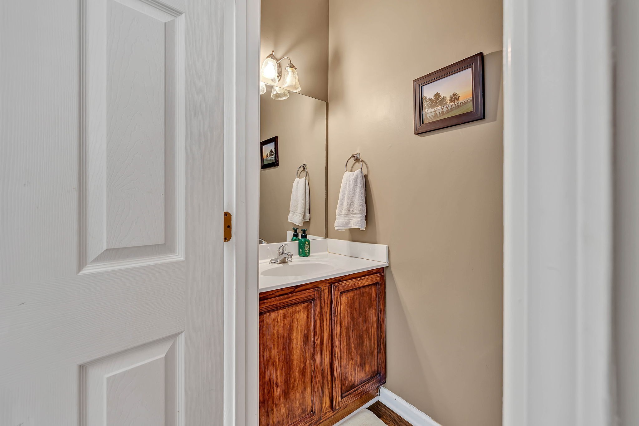 1101 Downs Boulevard, Unit I104 Franklin, TN 37064 - Photo 12 of 22 a bathroom with a sink and a mirror