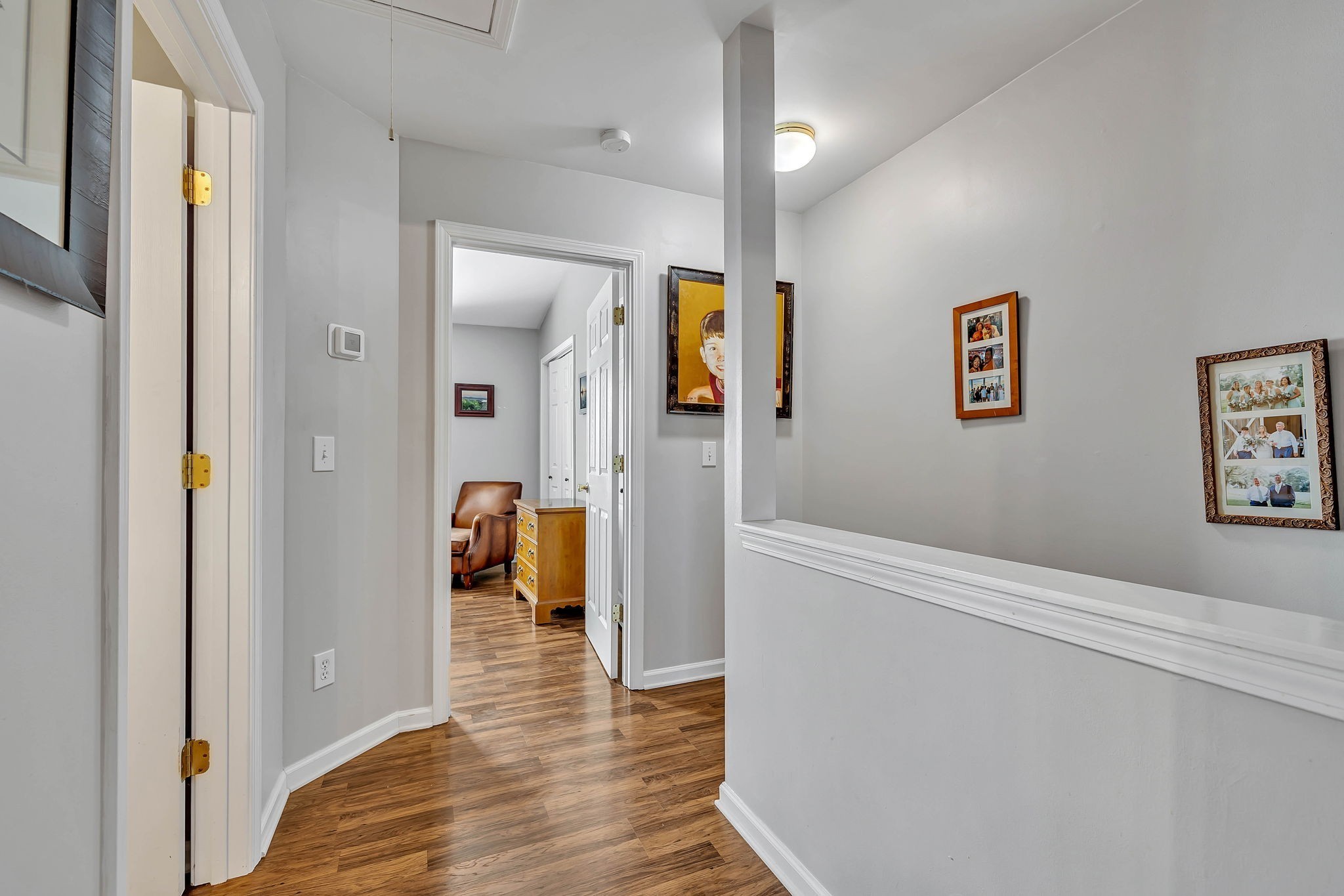 1101 Downs Boulevard, Unit I104 Franklin, TN 37064 - Photo 14 of 22 a view of a hallway view with wooden floor and staircase