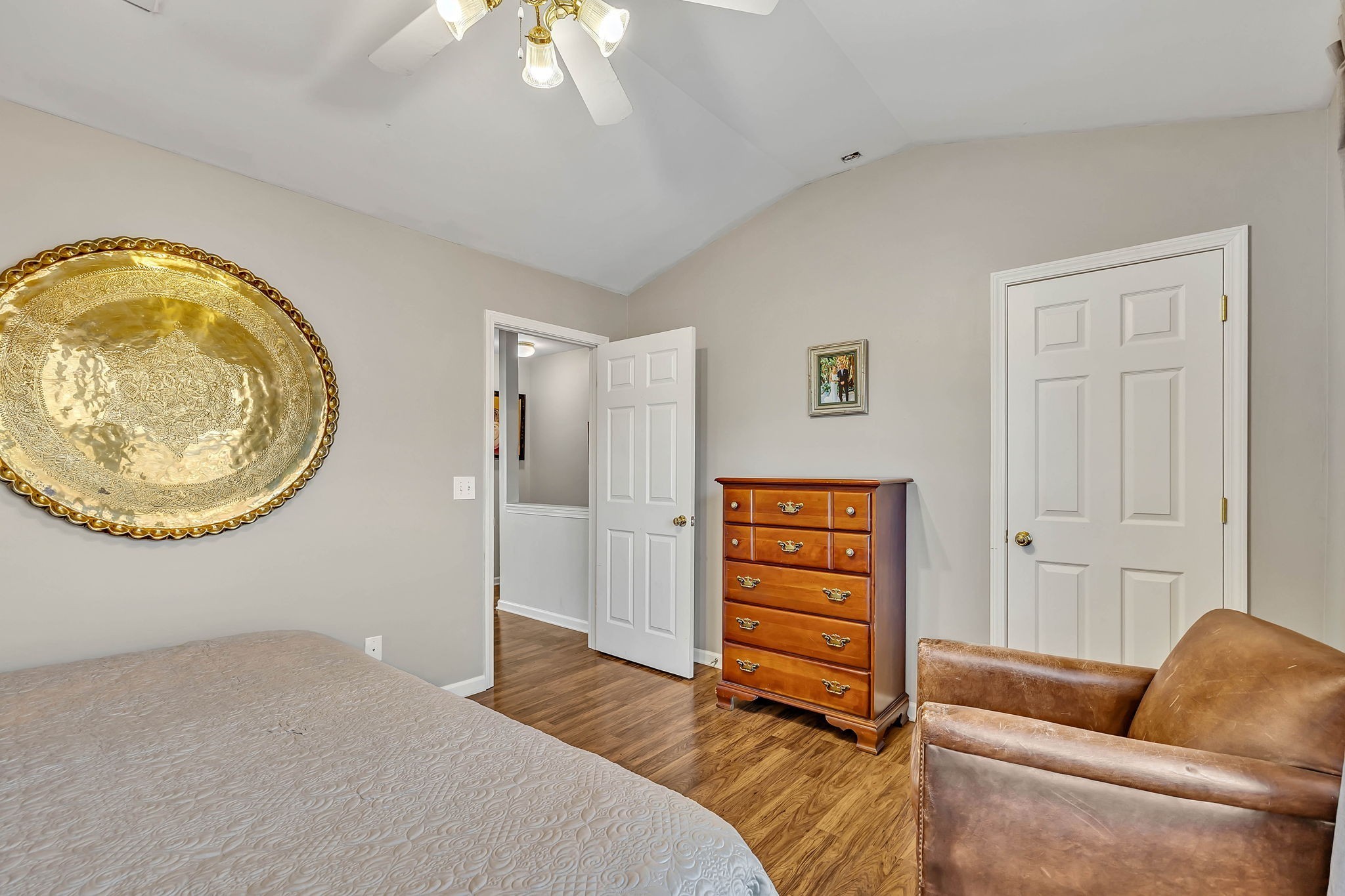 1101 Downs Boulevard, Unit I104 Franklin, TN 37064 - Photo 16 of 22 a bedroom with a bed and a chair
