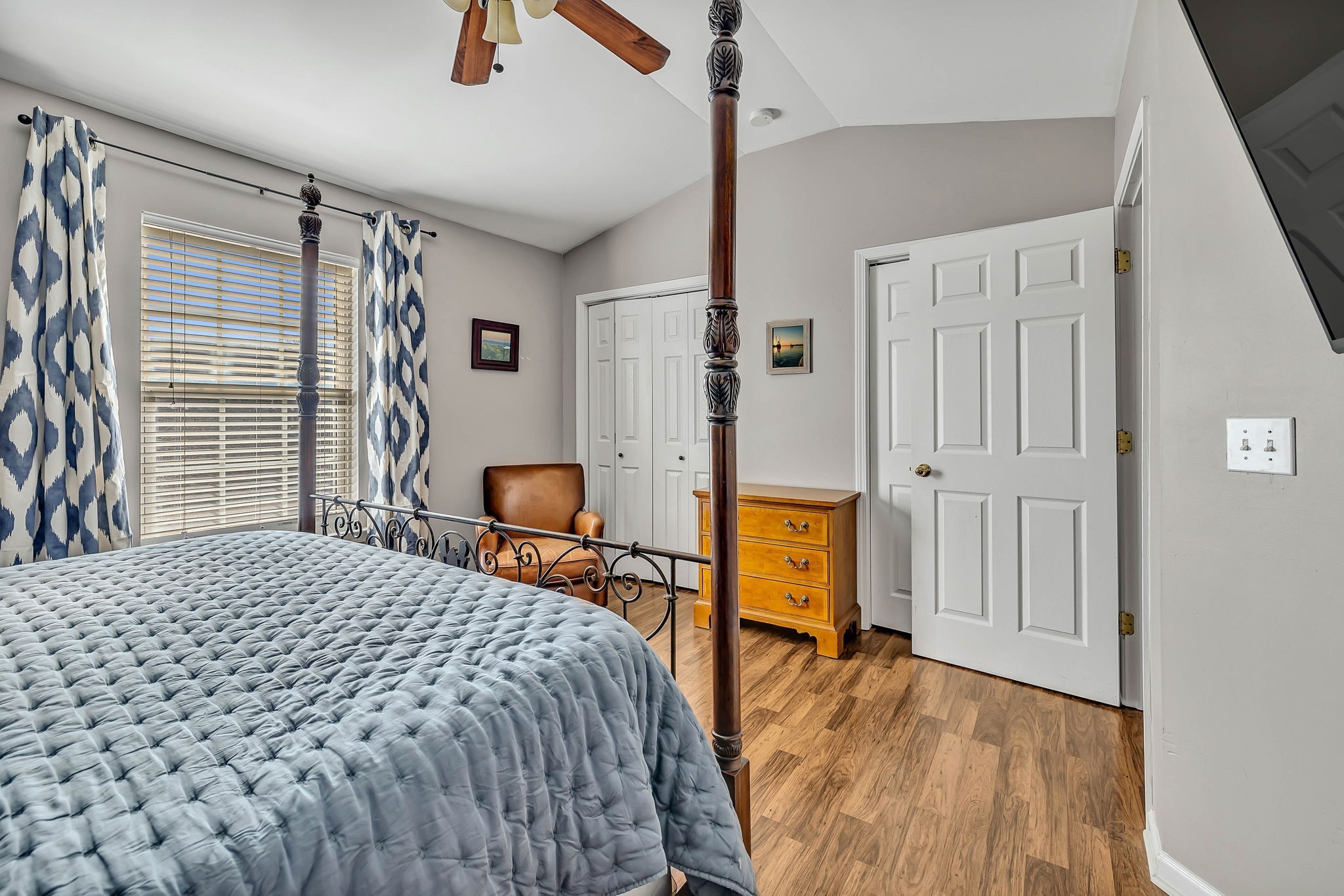 1101 Downs Boulevard, Unit I104 Franklin, TN 37064 - Photo 20 of 22 a bedroom with a bed and wooden floor