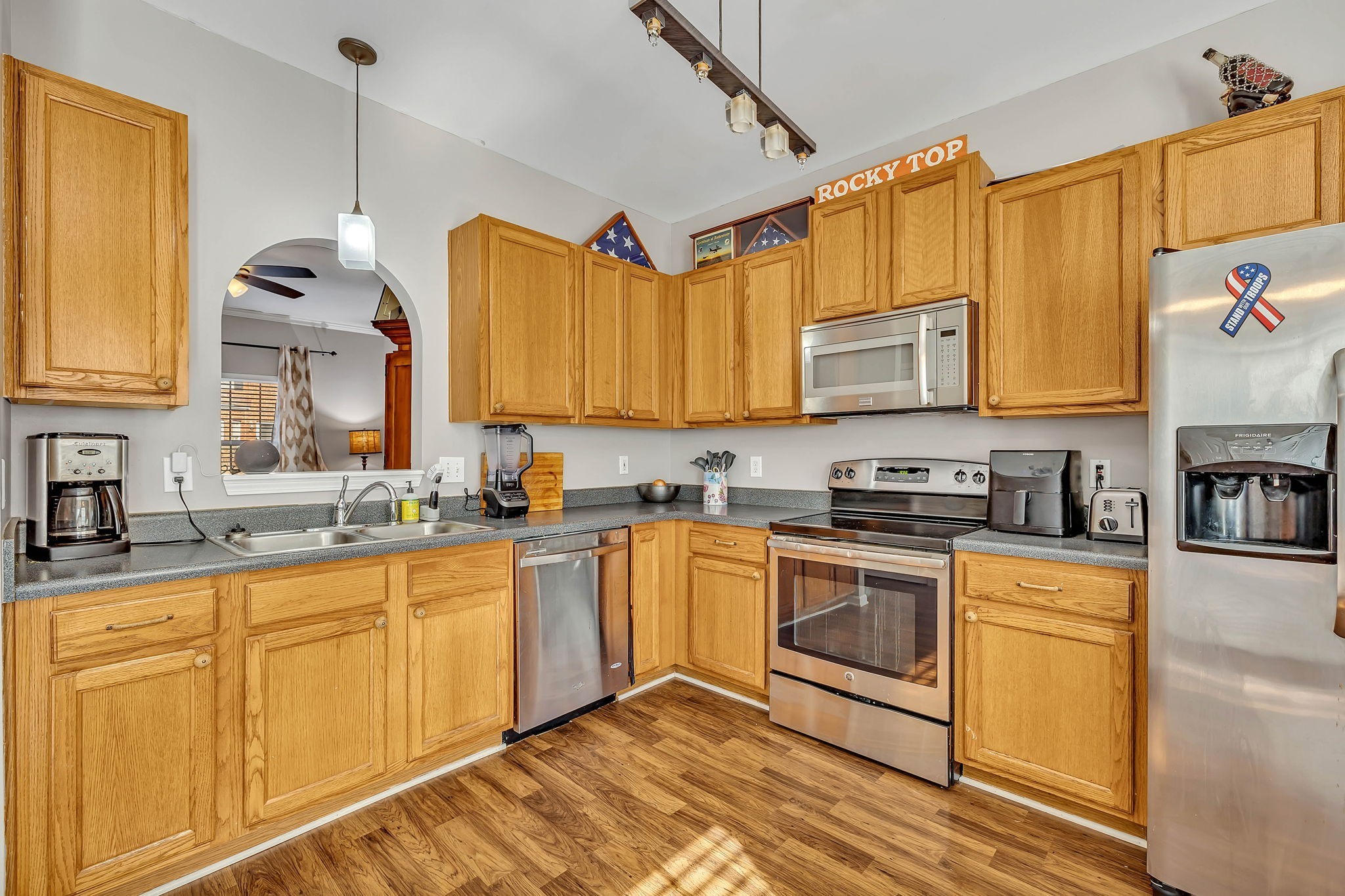 1101 Downs Boulevard, Unit I104 Franklin, TN 37064 - Photo 2 of 22 a kitchen with stainless steel appliances granite countertop a sink and cabinets