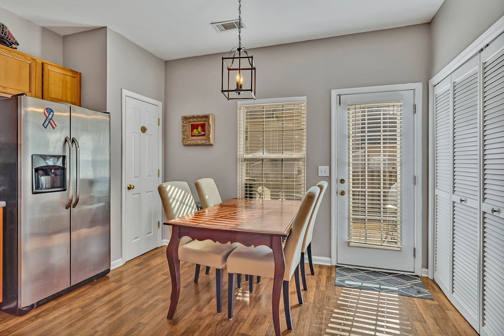 1101 Downs Boulevard, Unit I104 Franklin, TN 37064 - Photo 3 of 22 a view of a dining room with furniture window and wooden floor