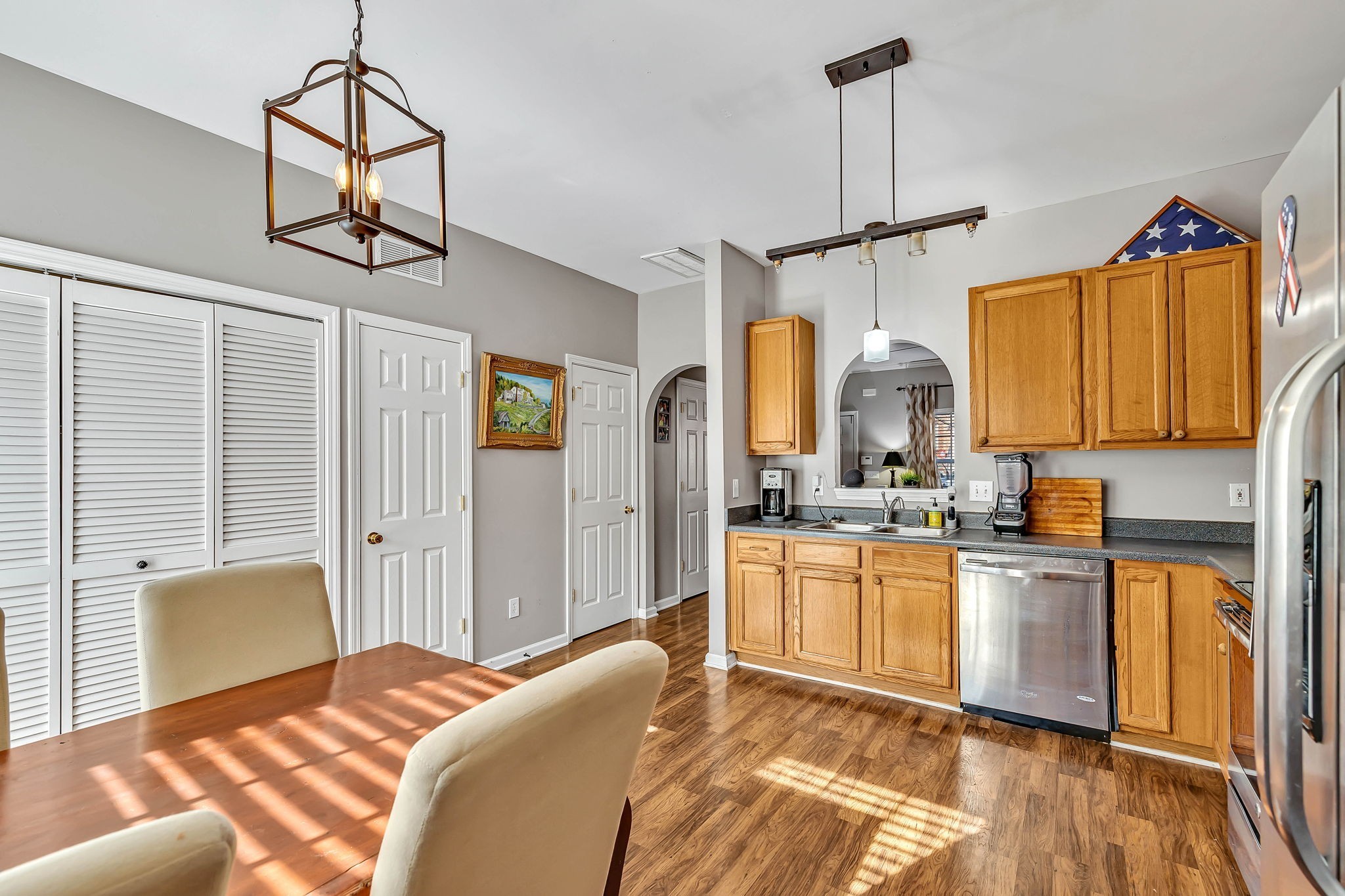 1101 Downs Boulevard, Unit I104 Franklin, TN 37064 - Photo 4 of 22 a kitchen with a stove a sink and a refrigerator