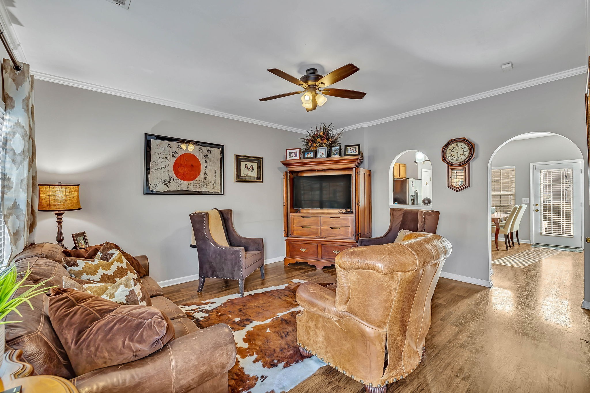 1101 Downs Boulevard, Unit I104 Franklin, TN 37064 - Photo 7 of 22 a living room with furniture and a flat screen tv