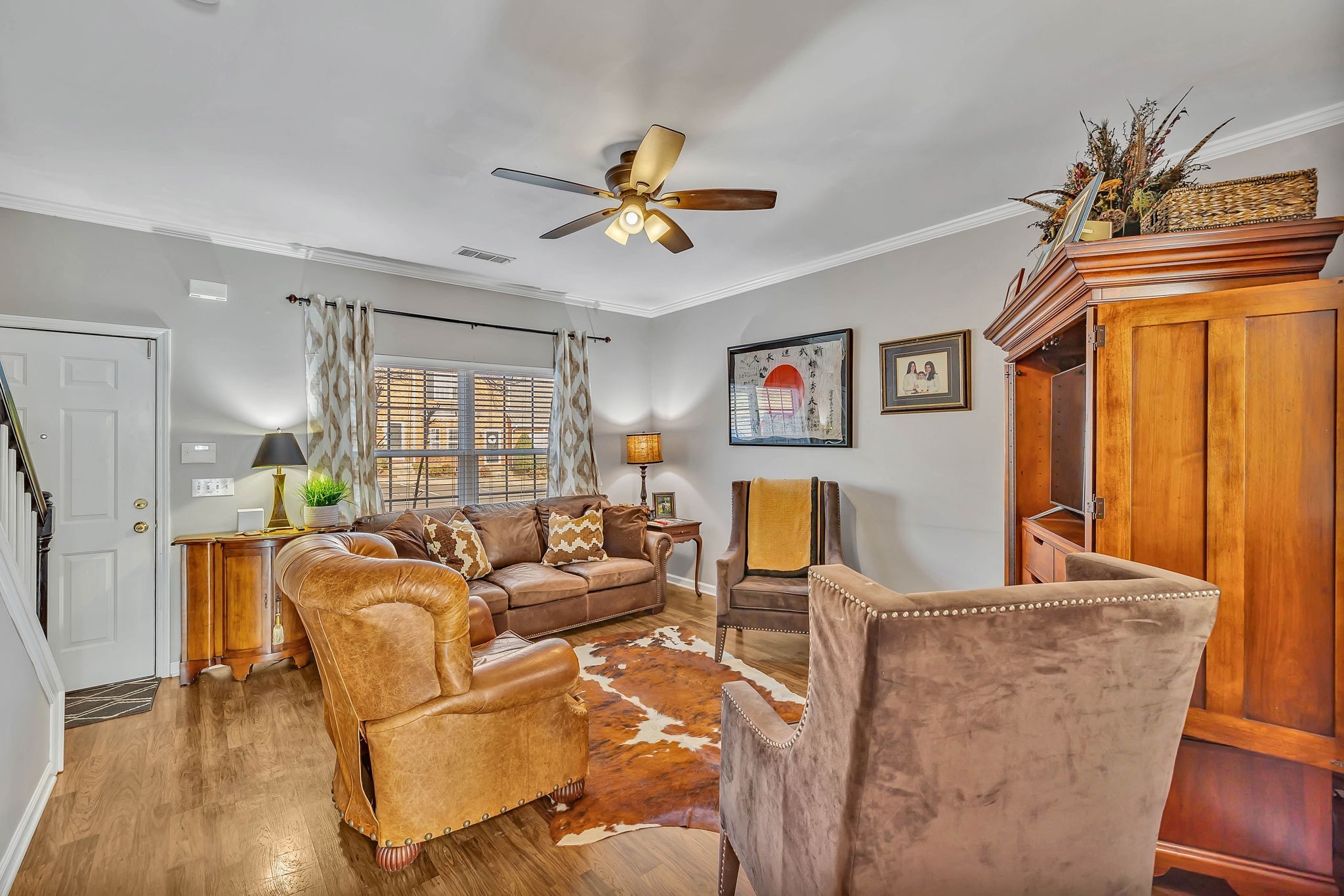 1101 Downs Boulevard, Unit I104 Franklin, TN 37064 - Photo 8 of 22 a living room with fireplace furniture and a wooden floor