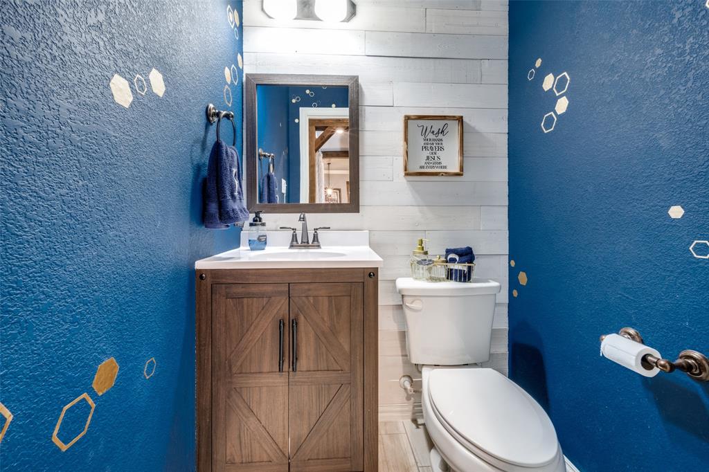 7417 Green Mesa Road Ponder, TX 76259 - Photo 28 of 39 a white toilet sitting next to a bathroom sink