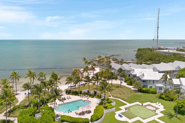 a view of multiple houses with a yard