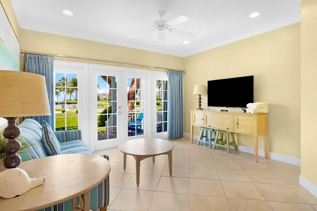 a kitchen with a stove a sink a dining table and chairs