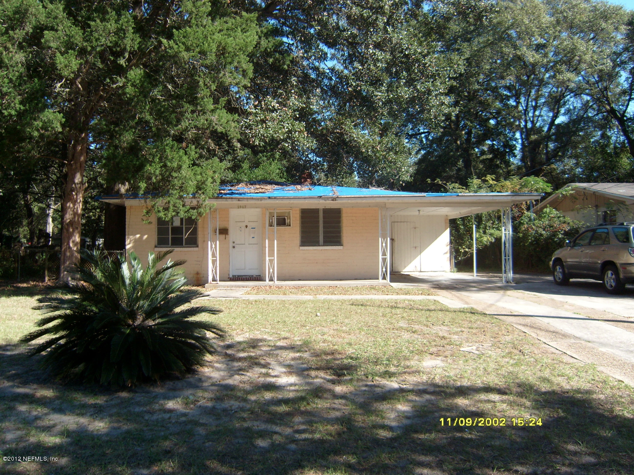 1947 Layton Road Jacksonville, FL 32211 - Photo 2 of 4 a view of a house with backyard and sitting area