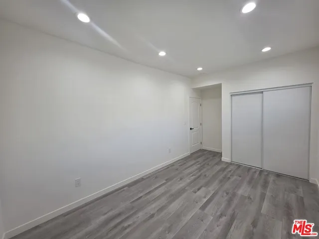 a view of wooden floor in an empty room