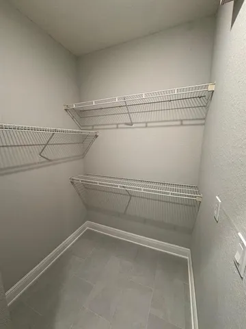 a view of a room with racks on the wall