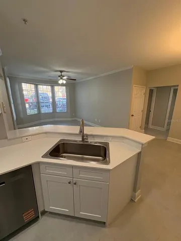 a kitchen with cabinets and sink