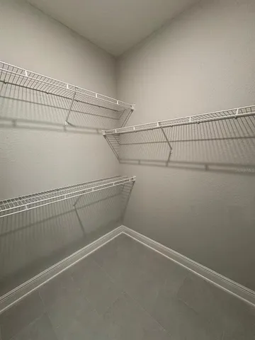 a view of a room with racks on the wall