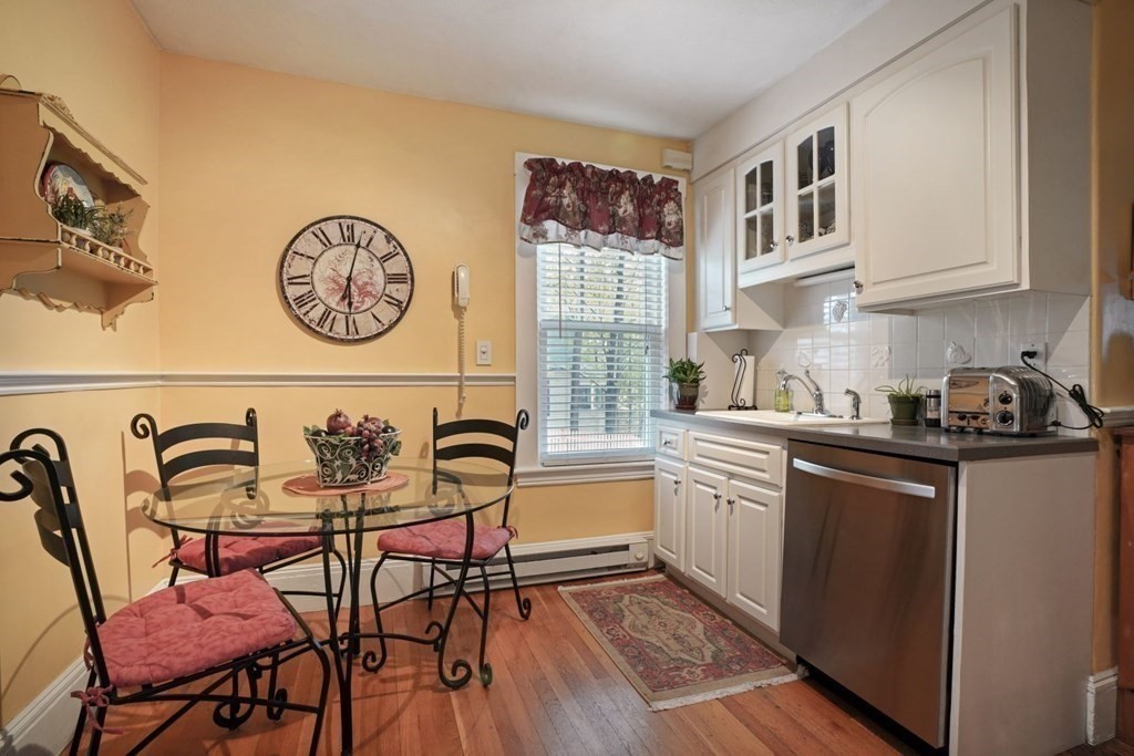 54 Olney Street Watertown, MA 02472 - Photo 12 of 28 a kitchen with a cabinets and a table