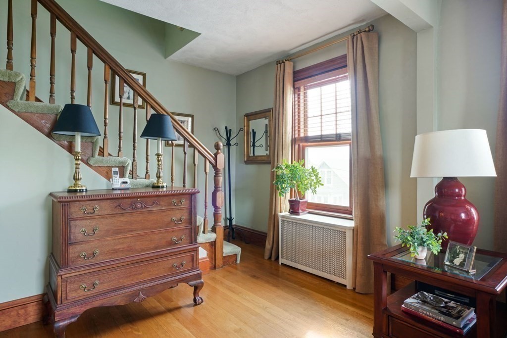 54 Olney Street Watertown, MA 02472 - Photo 16 of 28 a view of entryway with wooden floor and stairs