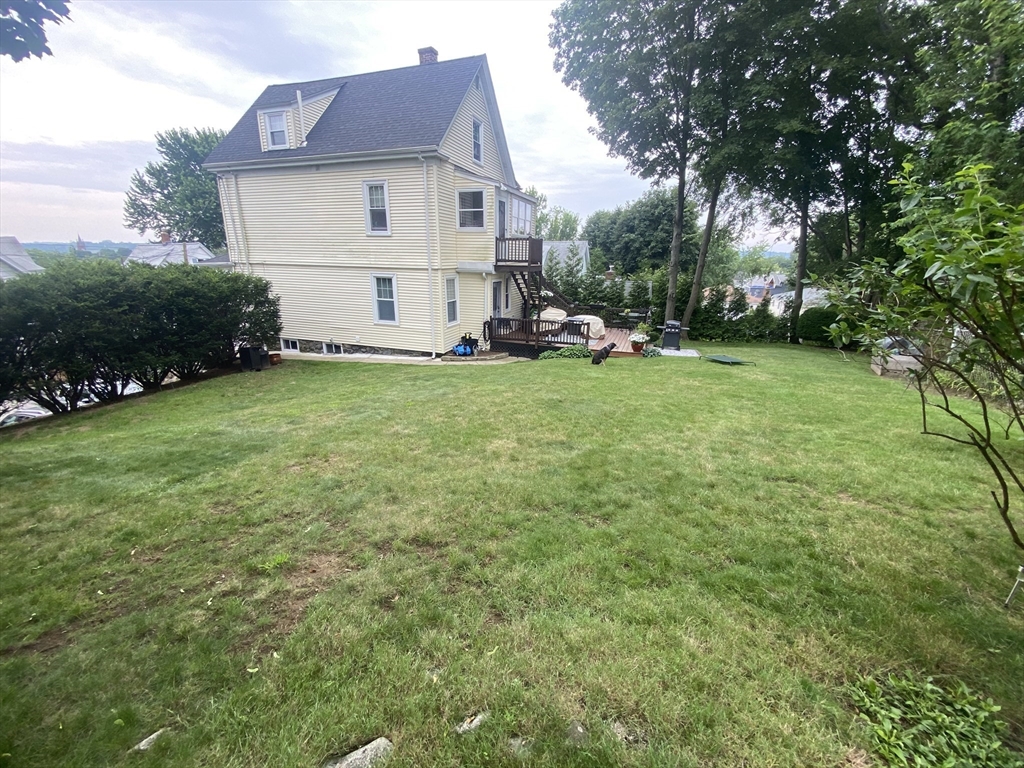 54 Olney Street Watertown, MA 02472 - Photo 22 of 28 a view of a back yard of the house