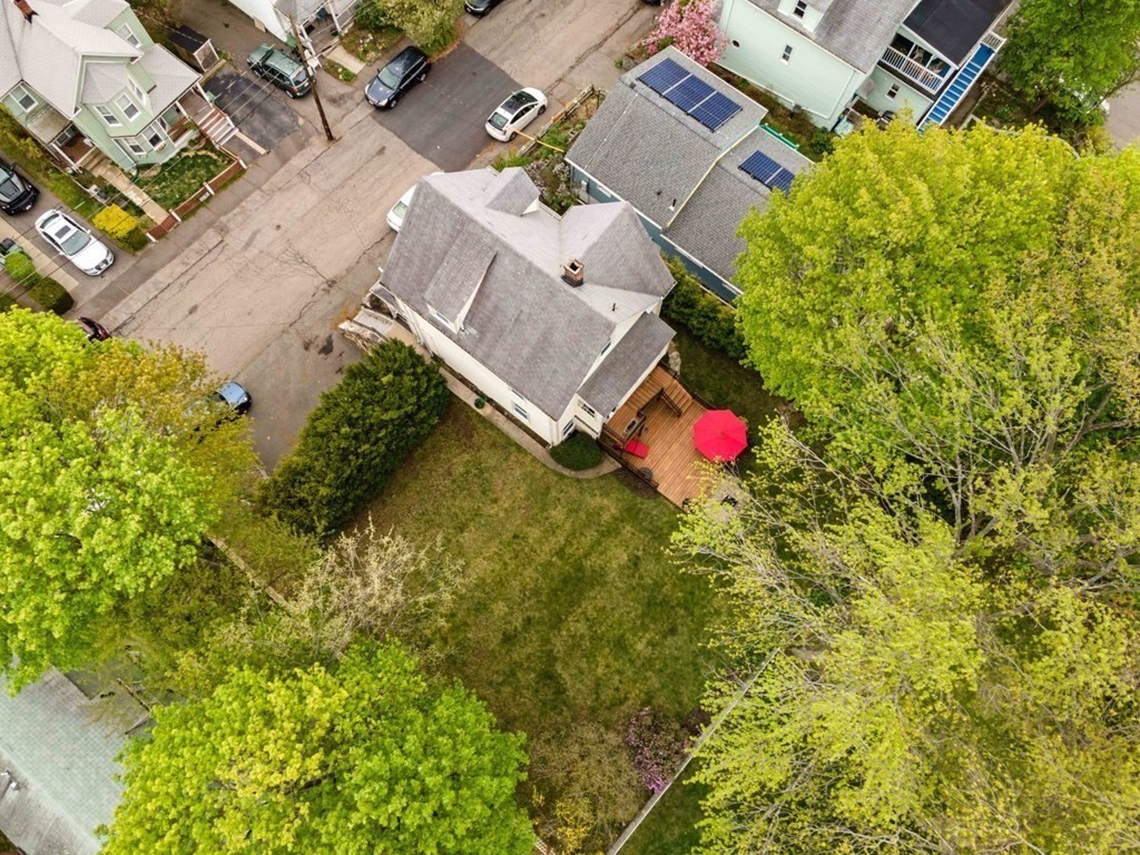54 Olney Street Watertown, MA 02472 - Photo 28 of 28 an aerial view of residential house with swimming pool and garden space