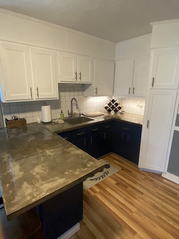54 Olney Street Watertown, MA 02472 - Photo 6 of 28 a kitchen with a sink and cabinets