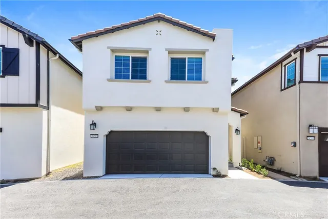 a front view of a house with yard