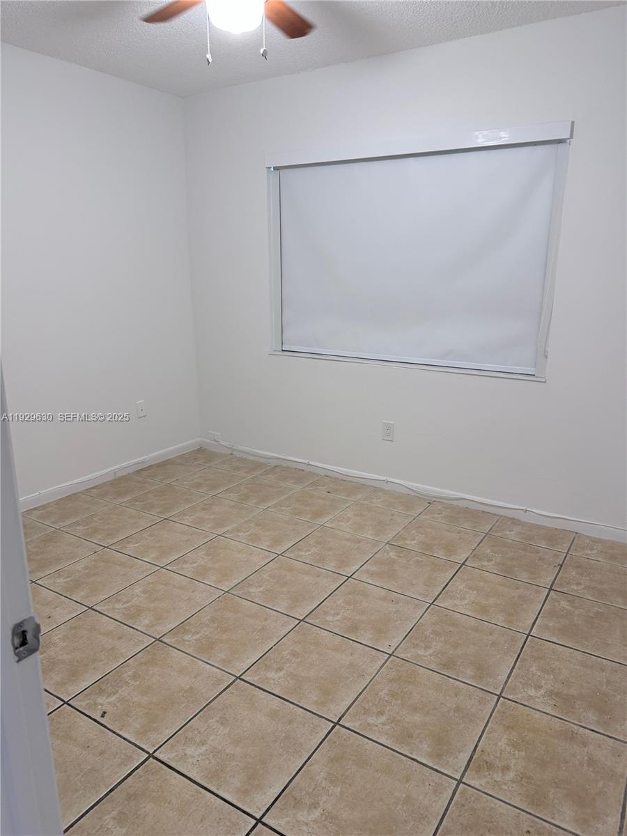 15312 Southwest 72nd Street, Unit 2112 Miami, FL 33193 - Photo 4 of 11 an empty room
