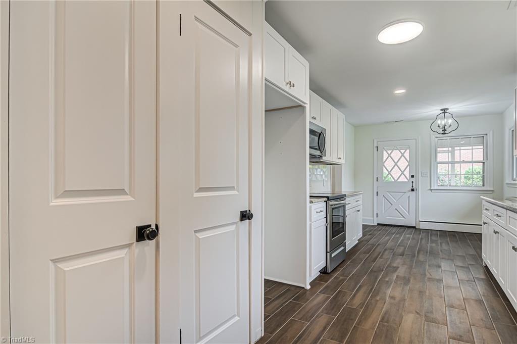 415 Kyle Road Winston-Salem, NC 27104 - Photo 15 of 37 Kitchen view and dual pantry doors