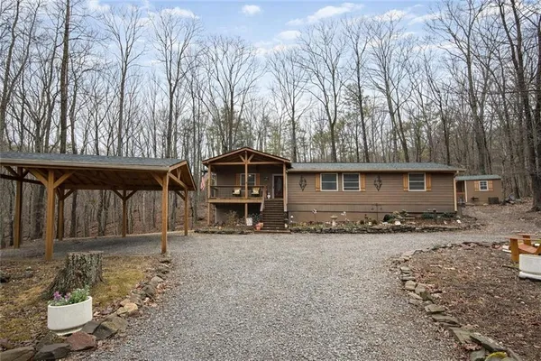 a front view of a house with parking space