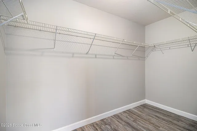 a view of a room with racks on the wall