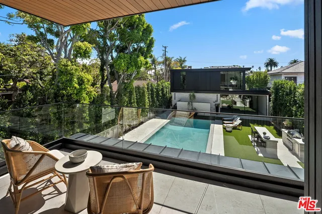 a view of a yard with chairs