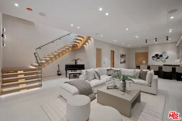 a living room with furniture or stairs and a living room