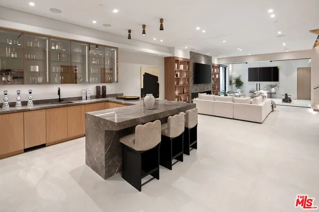 a large kitchen with a table and chairs