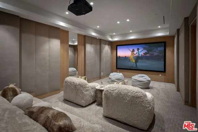 a bedroom with bed and a flat screen tv