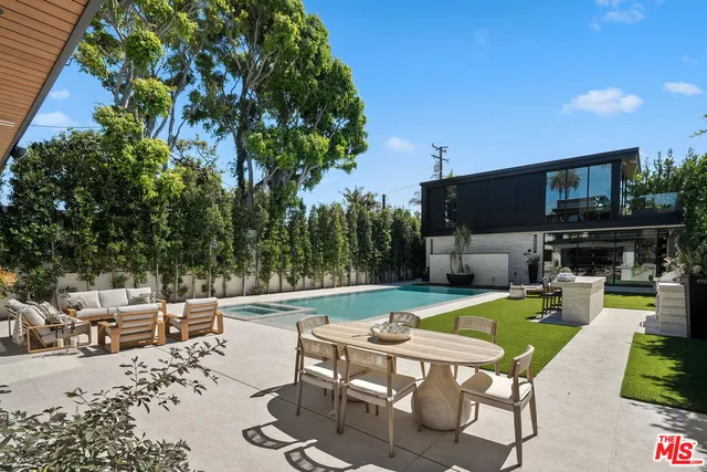 a view of a swimming pool with chairs