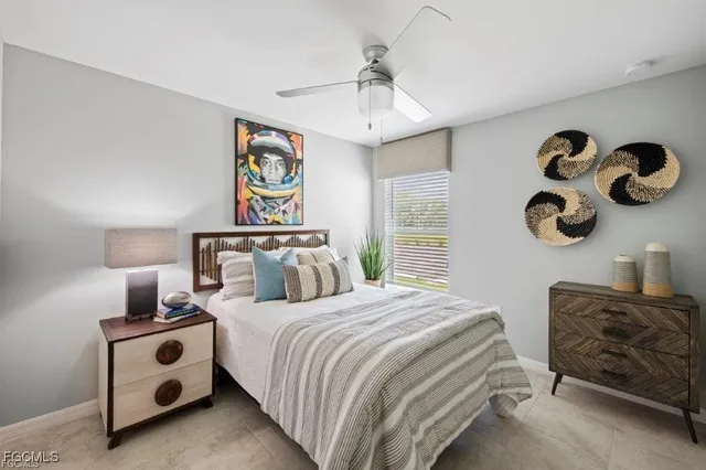 a bedroom with bed and cabinets