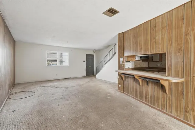 a view of kitchen with microwave and furniture