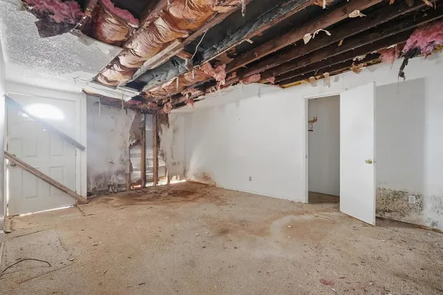 a view of a room with wooden walls
