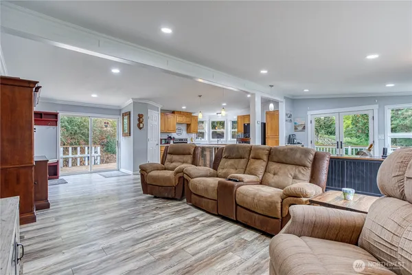 a living room with furniture window and wooden floor