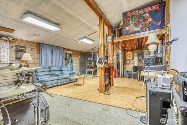 a view of a kitchen with kitchen island dining table and stainless steel appliances
