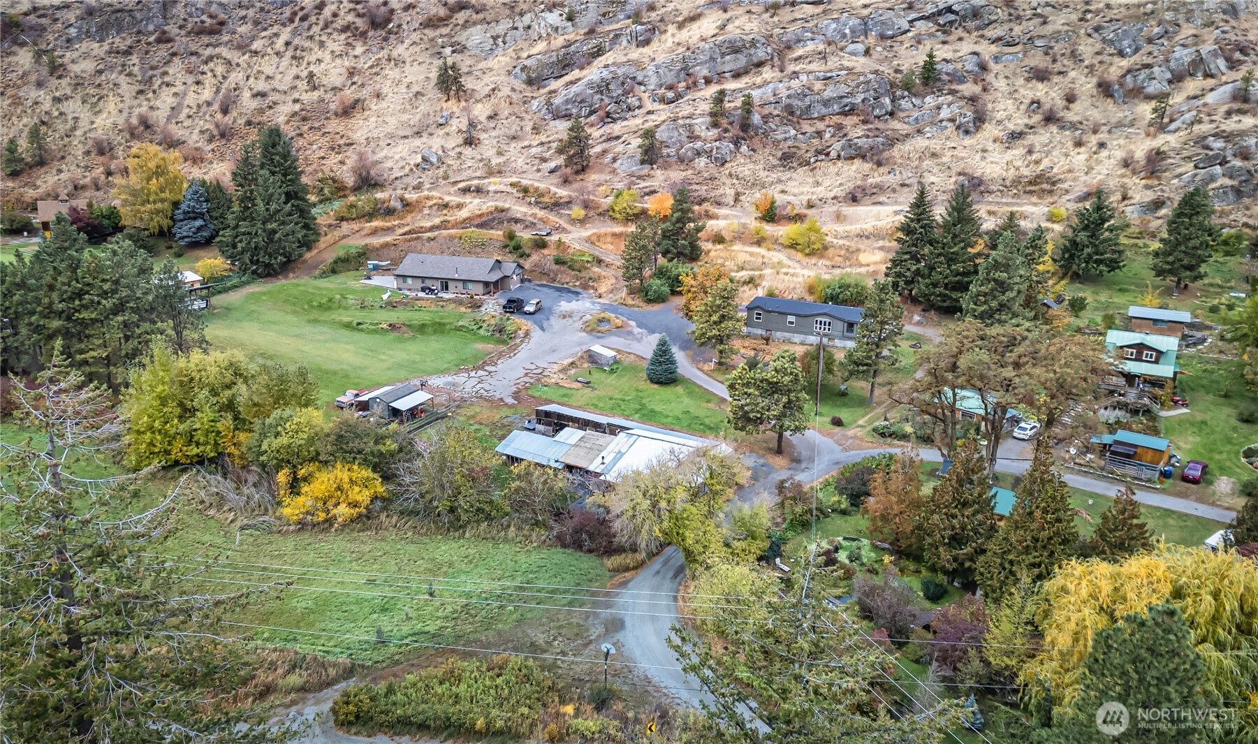 65 Sandstone Lane Cashmere, WA 98815 - Photo 26 of 39 an aerial view of residential houses with outdoor space and trees