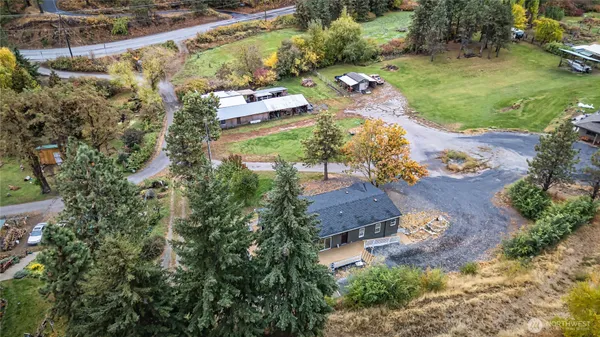 an aerial view of a house with a yard