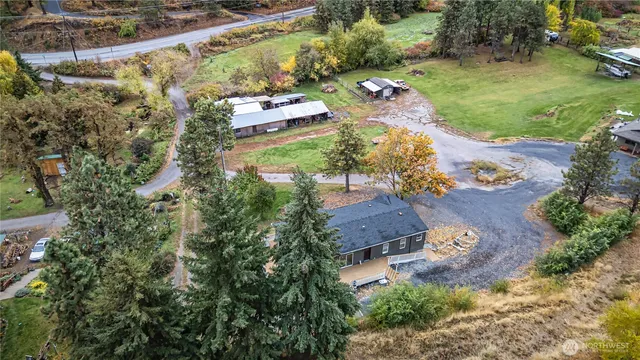 an aerial view of a house with a yard