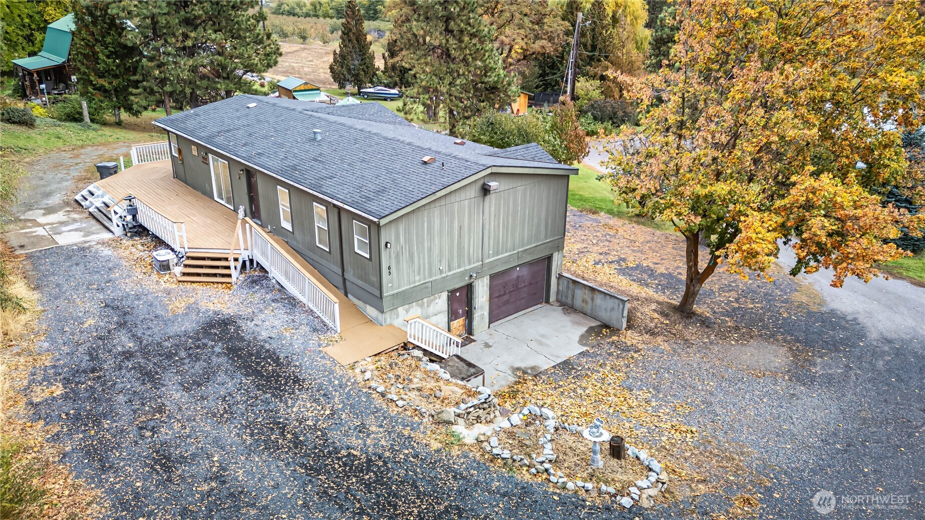 65 Sandstone Lane Cashmere, WA 98815 - Photo 3 of 39 a view of a house with a yard and roof deck