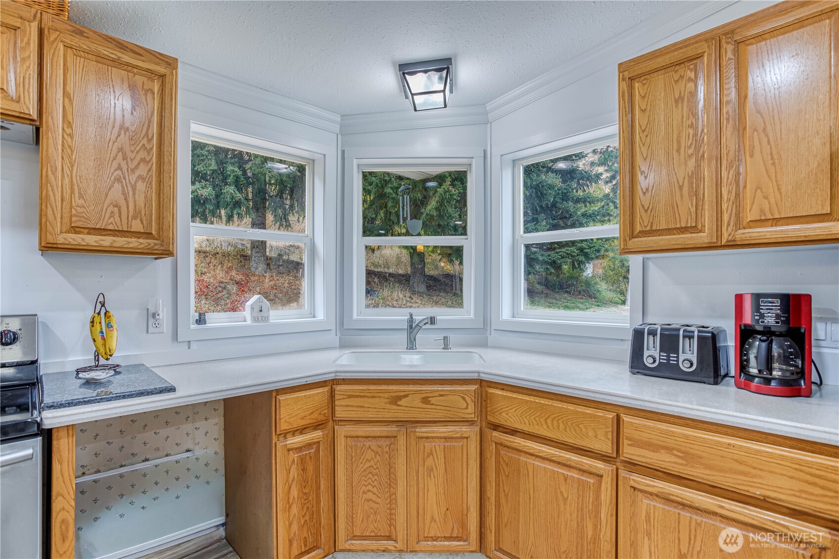 65 Sandstone Lane Cashmere, WA 98815 - Photo 6 of 39 a kitchen with stainless steel appliances sink refrigerator and window